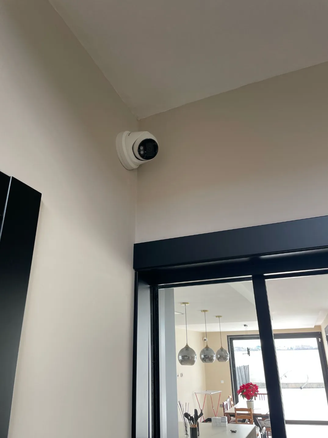 Smart indoor security camera installed in a corner for home monitoring and safety.