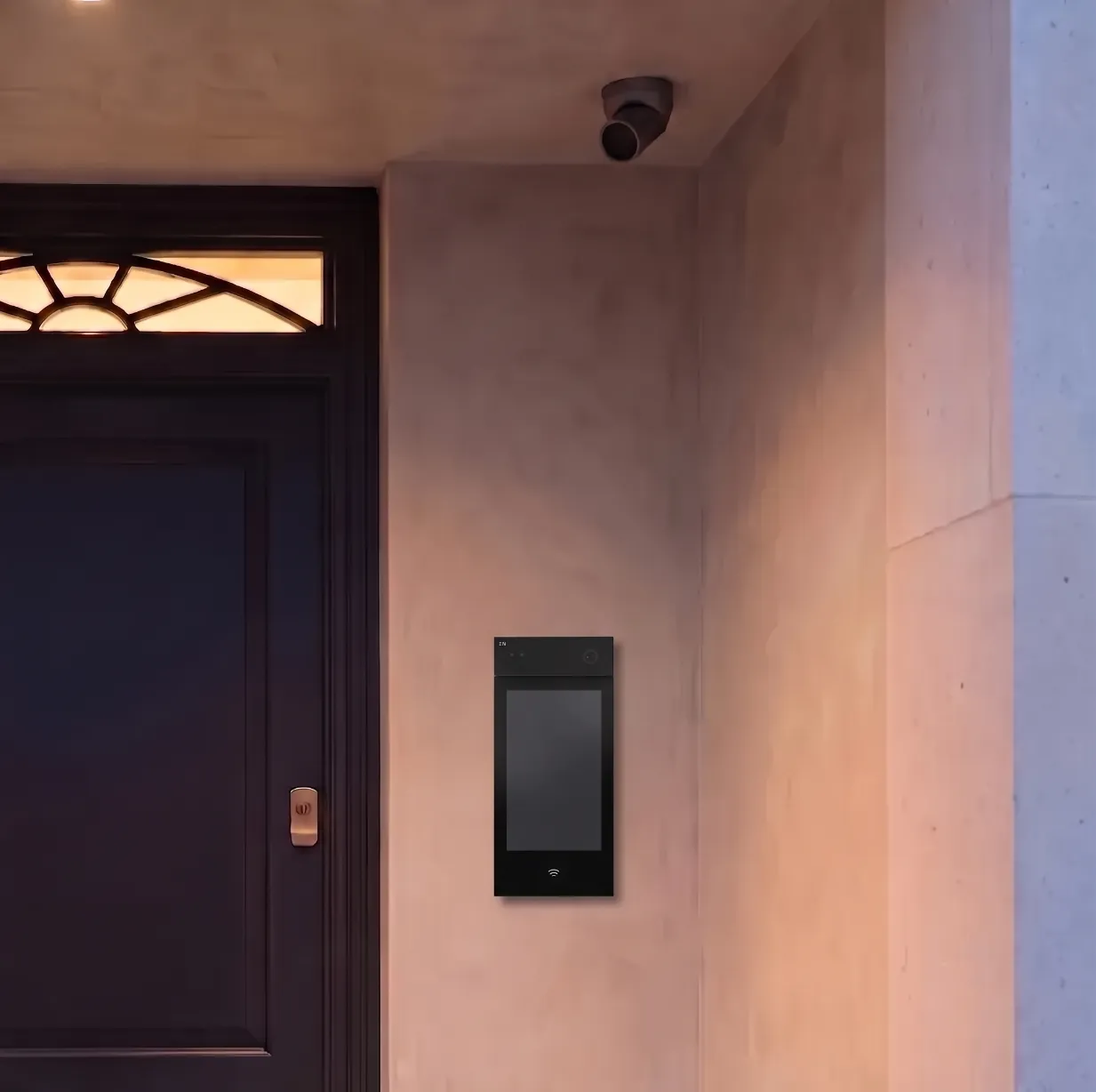Discreet exterior camera and video intercom at the entrance of a London residence